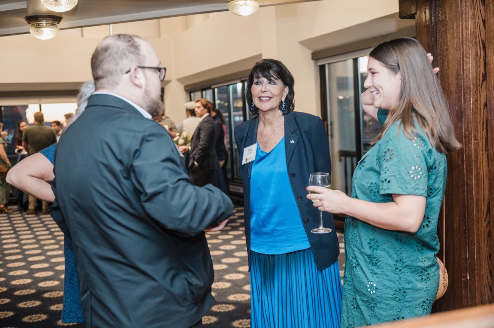 President Mantella conversing with GVSU Alumni